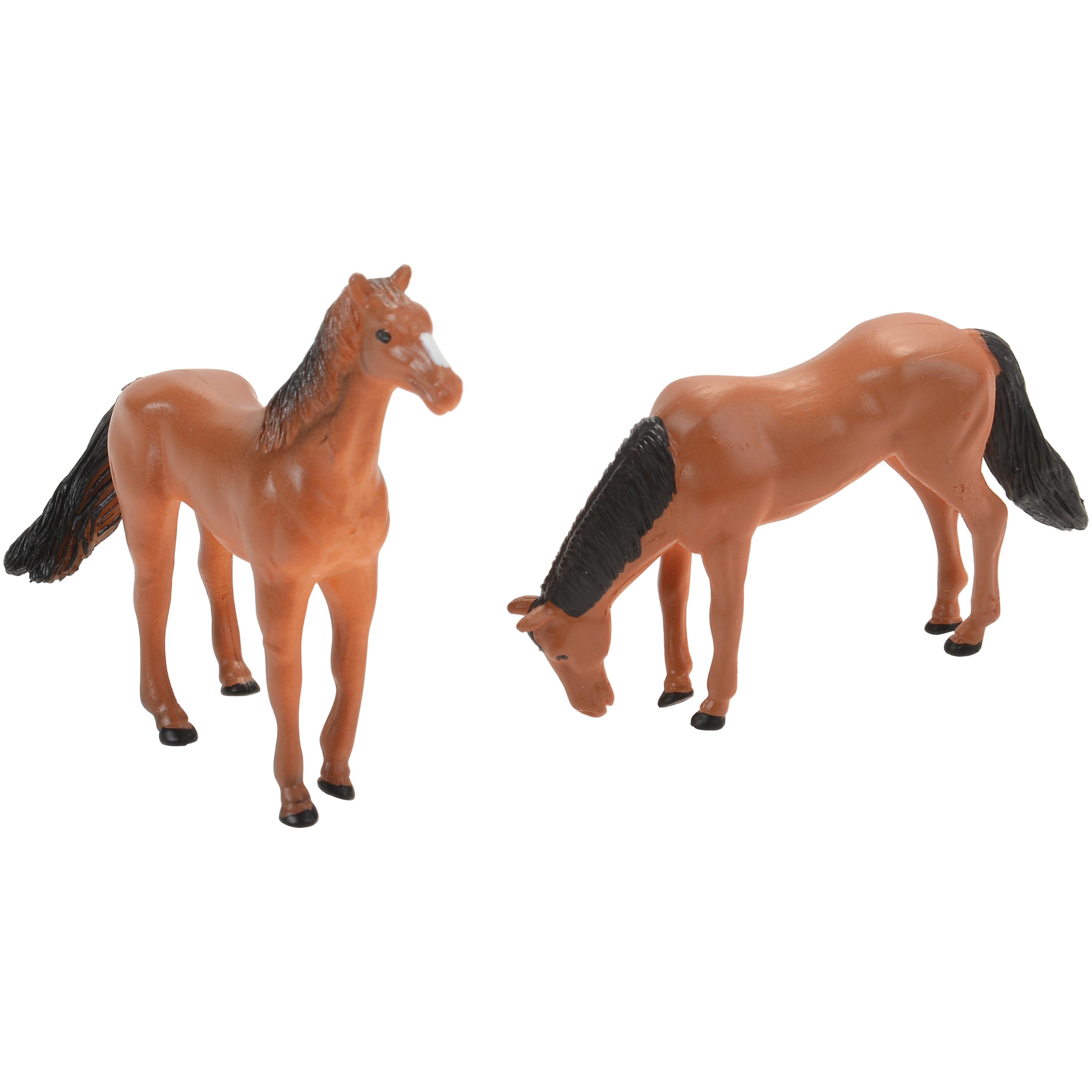 Two toy horses on a white background