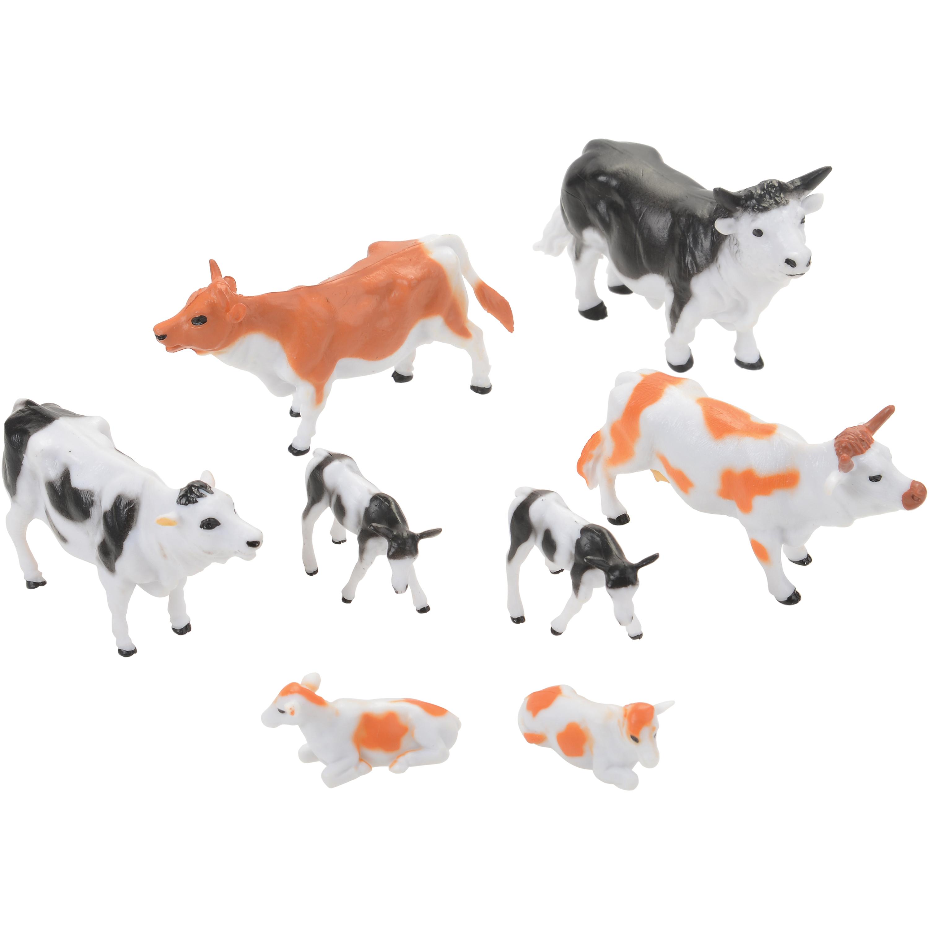 Set of cow figurines in various colors on a white background