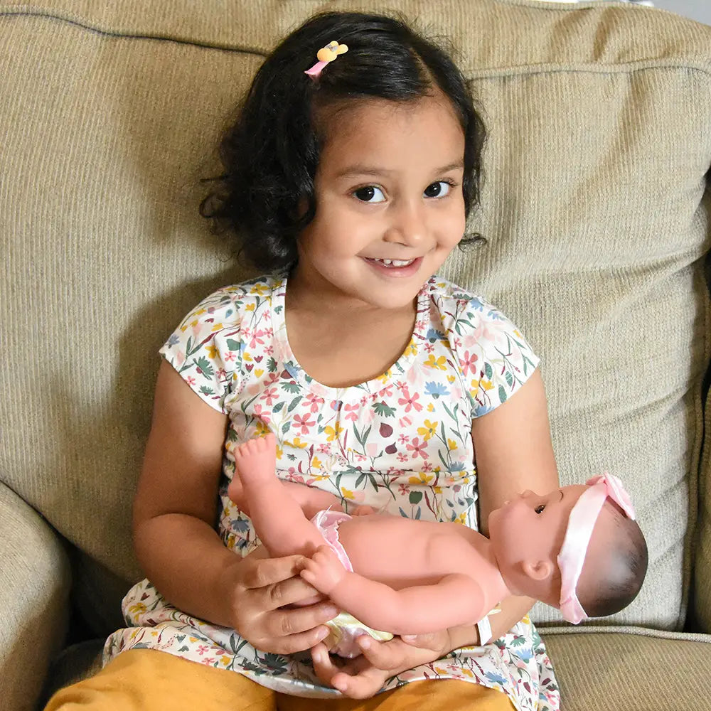 Kid Holding Realistic Tender Touch Hispanic Baby Doll