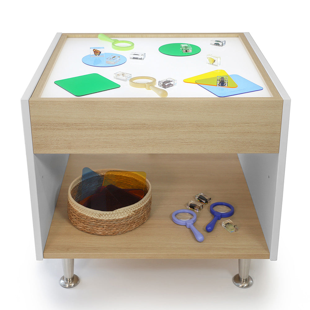 Children's activity table with educational toys and materials on a white background