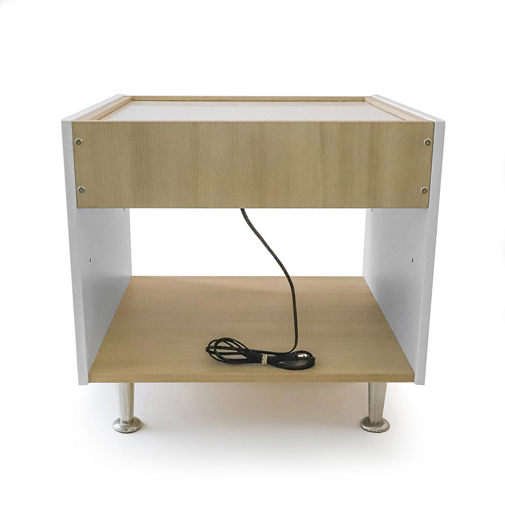 Wooden light table with white frame and metal legs on a white background