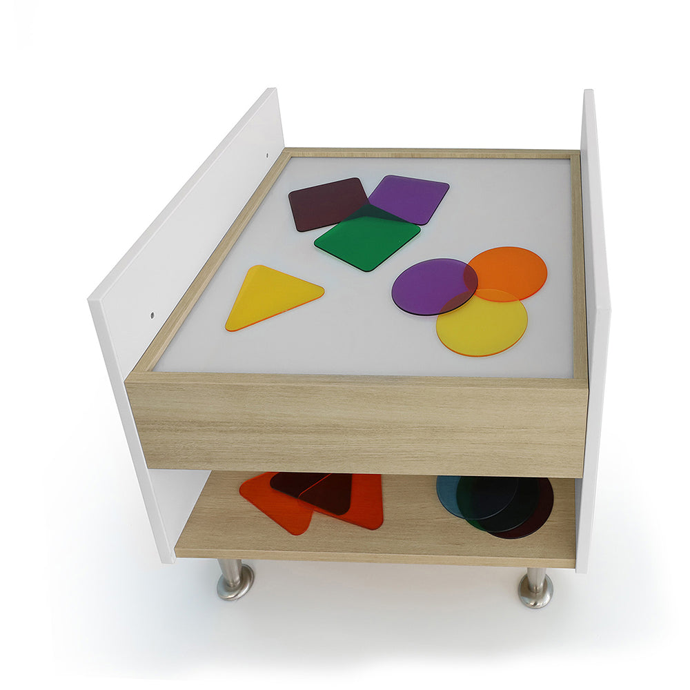 Colorful geometric shapes on a wooden tray with a white background