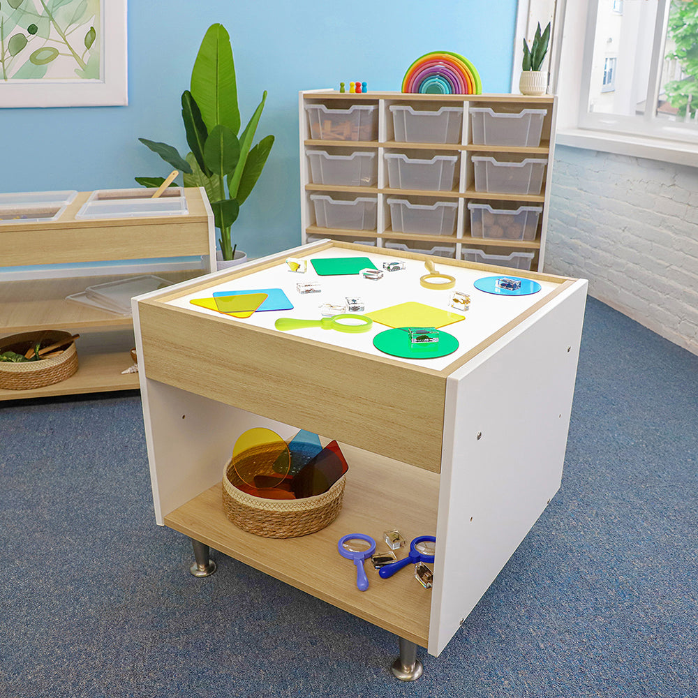 Children's play table with educational toys in a classroom setting