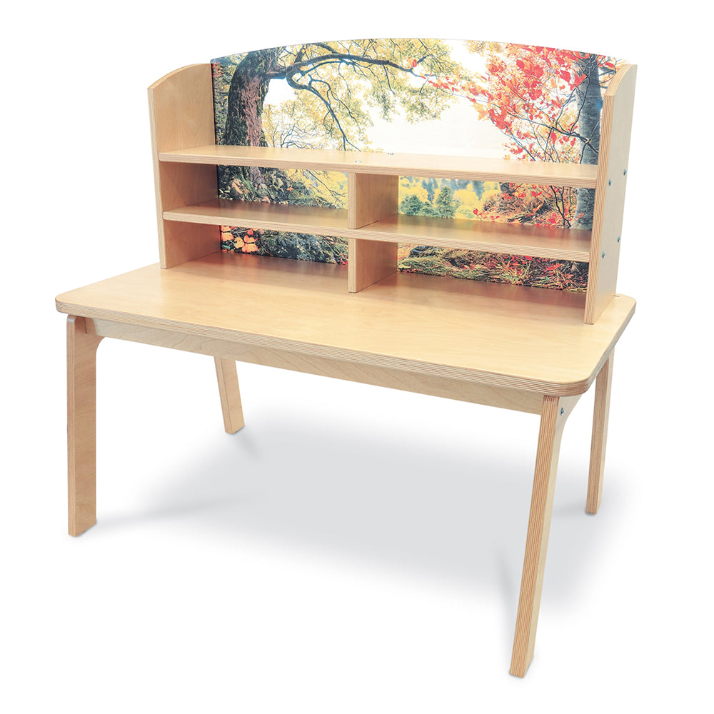 Wooden desk with a colorful nature-themed backrest on a white background