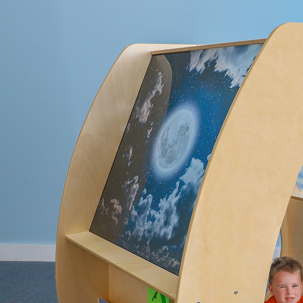 Children's educational exhibit with a screen displaying an image of the moon and clouds against a blue sky.