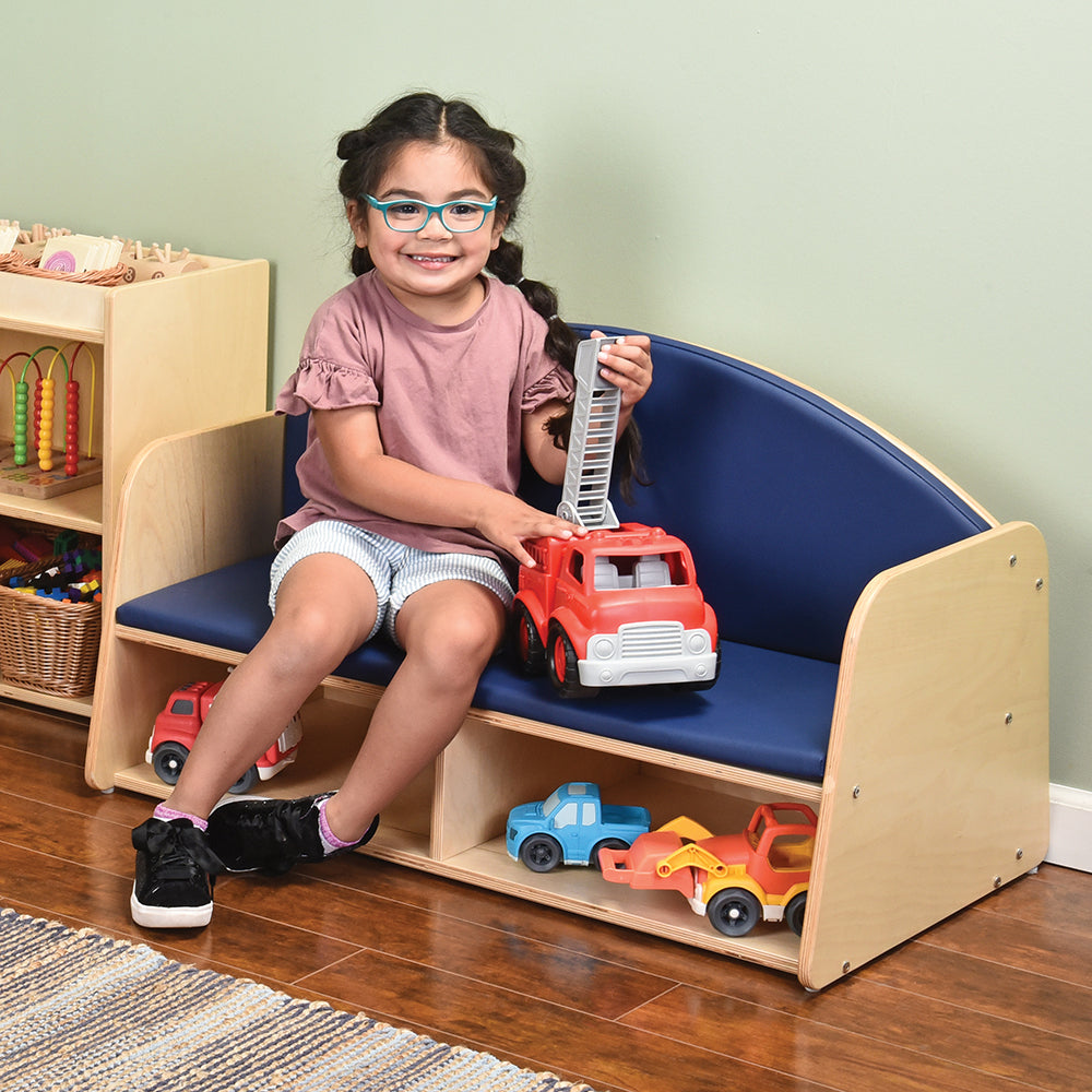Kid Playing with a Truck on the Classic Classroom Couch