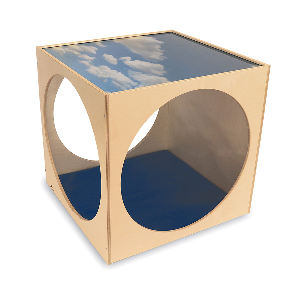 Wooden cube with circular cutouts and a blue sky and cloud pattern on top
