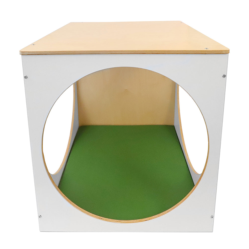 Wooden play cube with a green interior on a white background