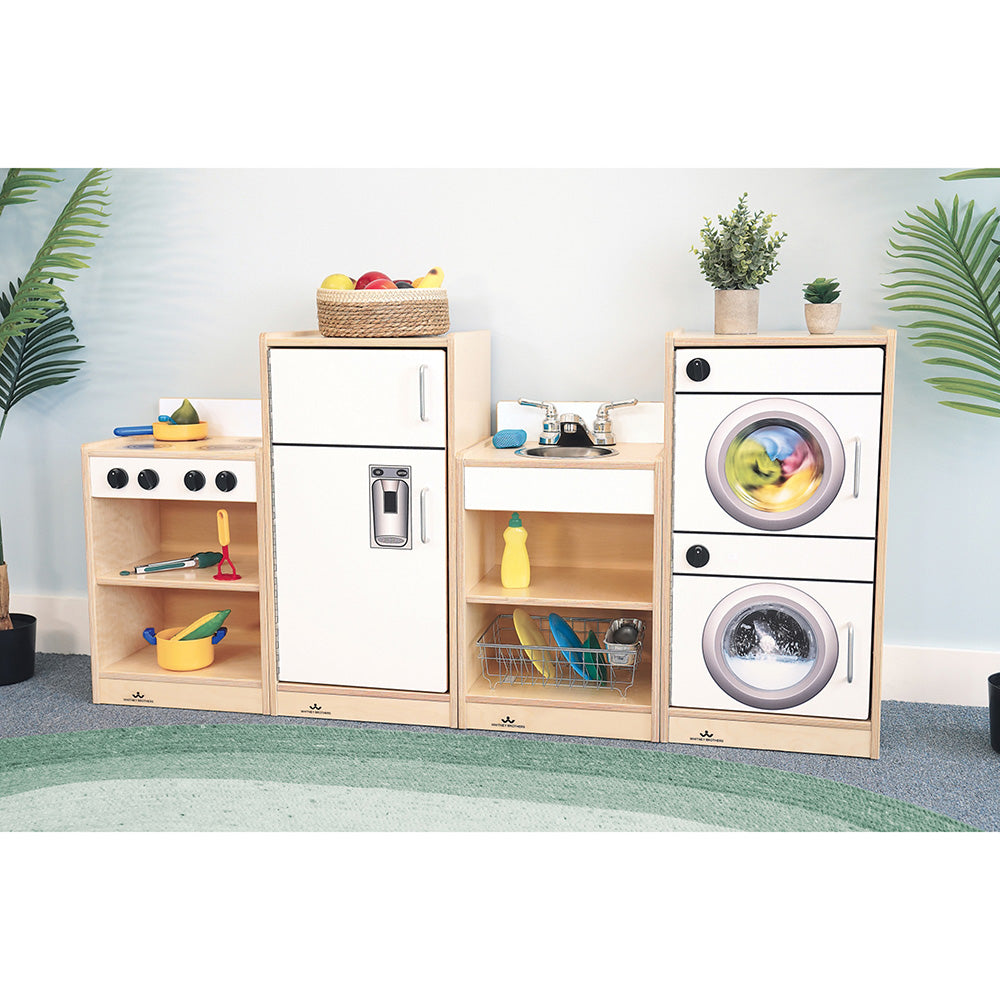 Children's play kitchen set with wooden cabinets and toy appliances on a light blue wall background.