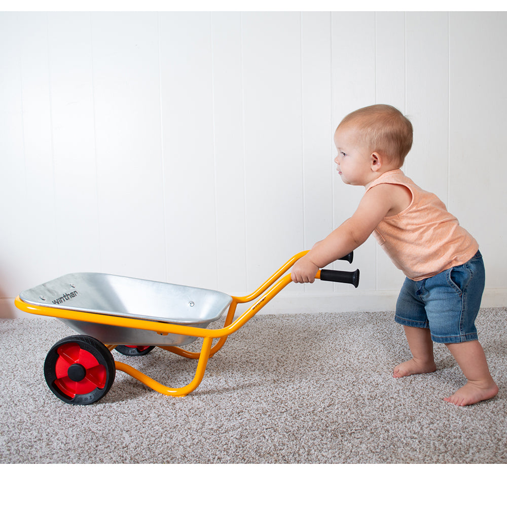 Toddler Pushing Wheelbarrow