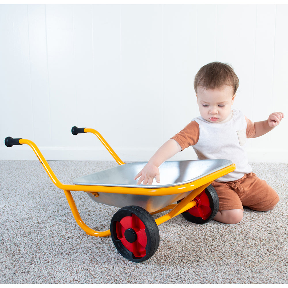 Toddler Investigating Wheelarrow