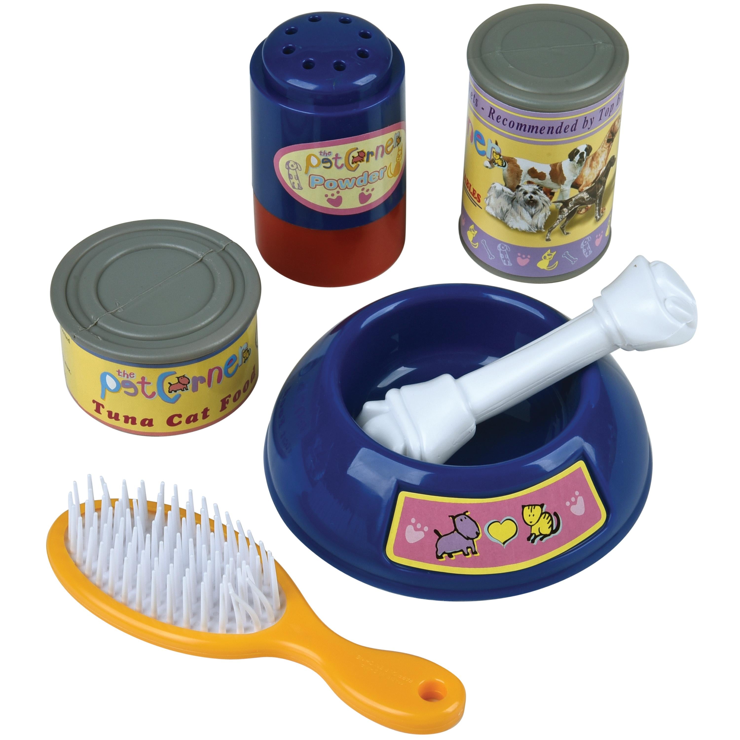 Pet grooming set with brush, bowl, and cans on a white background