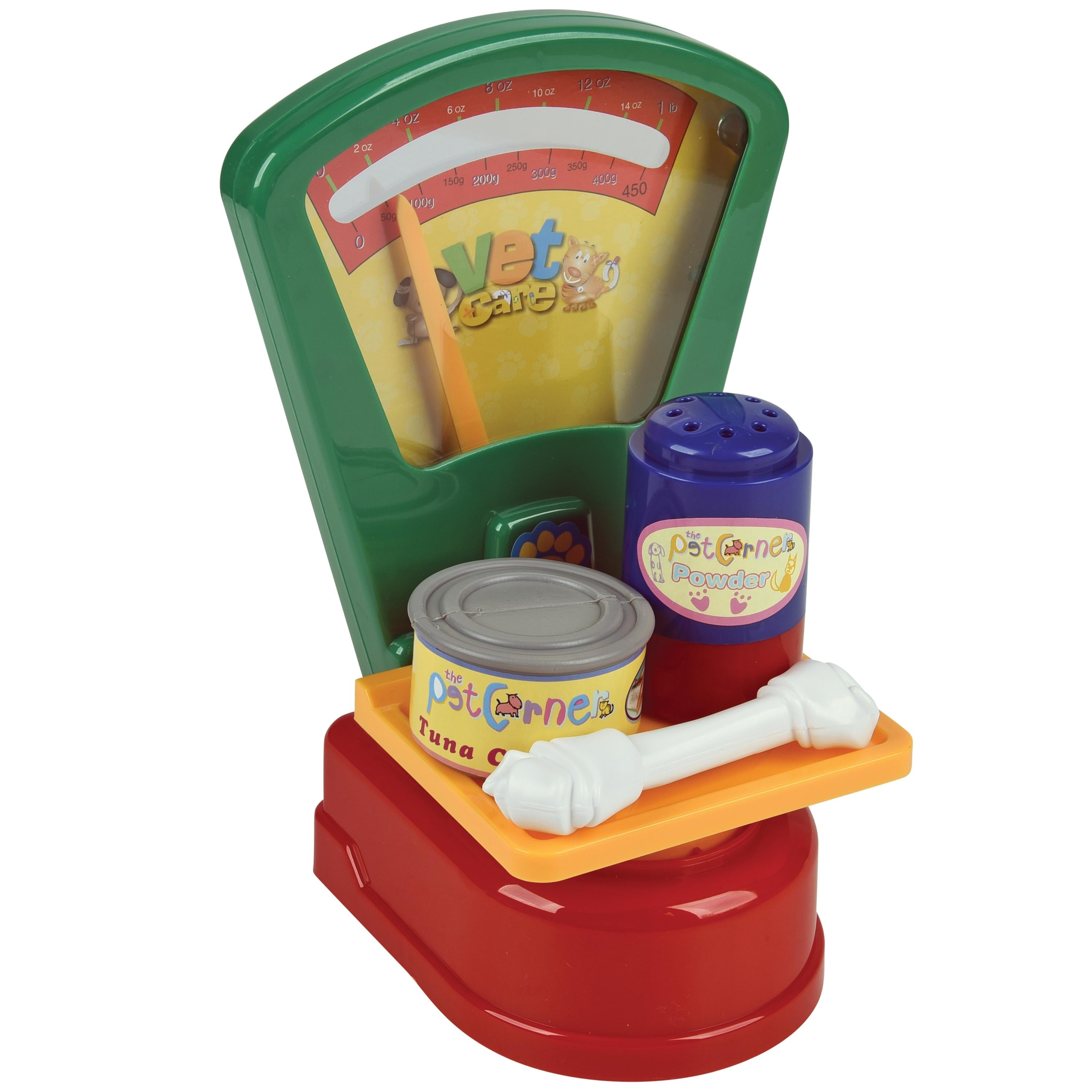 Toy pet scale with accessories on a white background