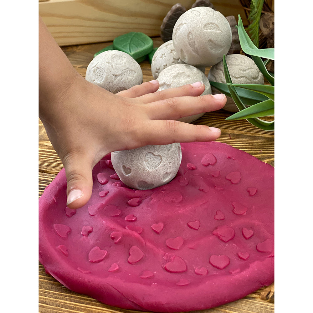 Kid Using Roll Around-Feel Calm Sensory Rollers with Pink Modeling Dough