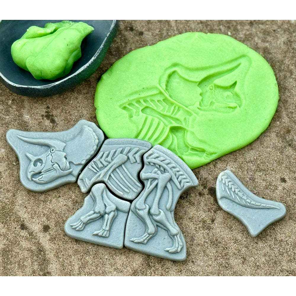Making Imprints in Modeling Dough with Dino Fossil Puzzle Pieces