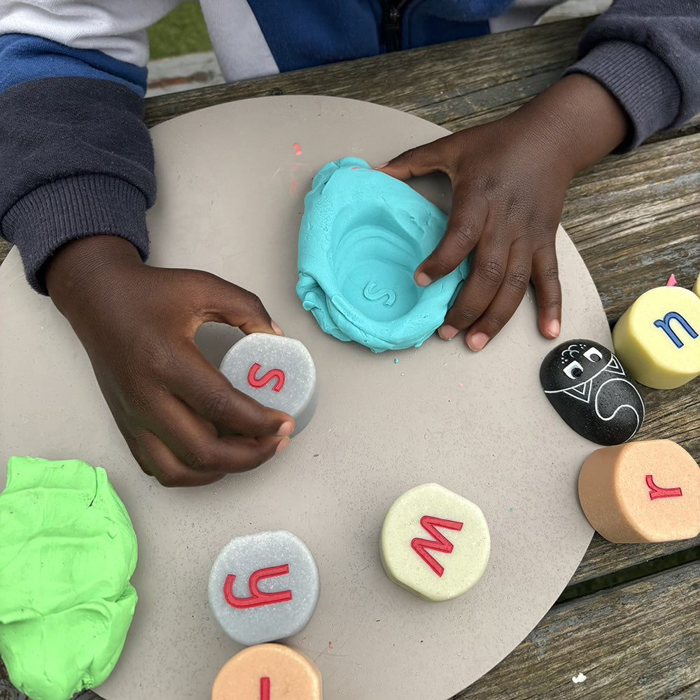 Stamping with Tactile Lowercase Alphabet Stones in Modeling Dough