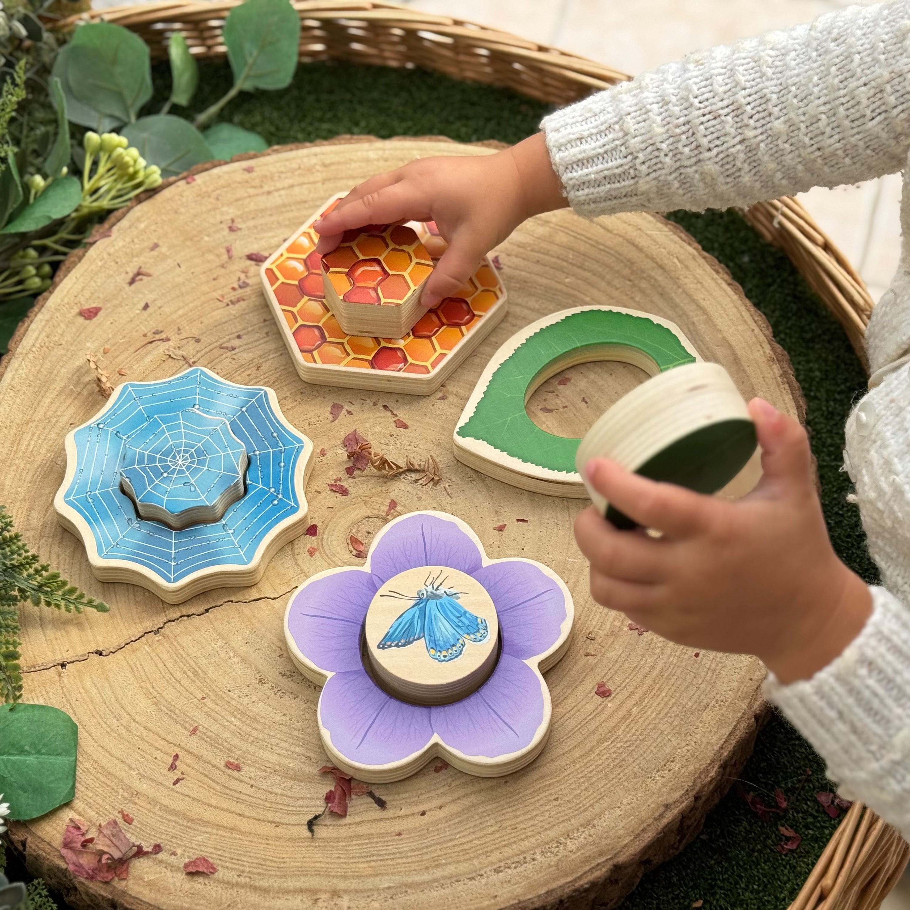 Children's wooden toys on a wooden surface with a natural background