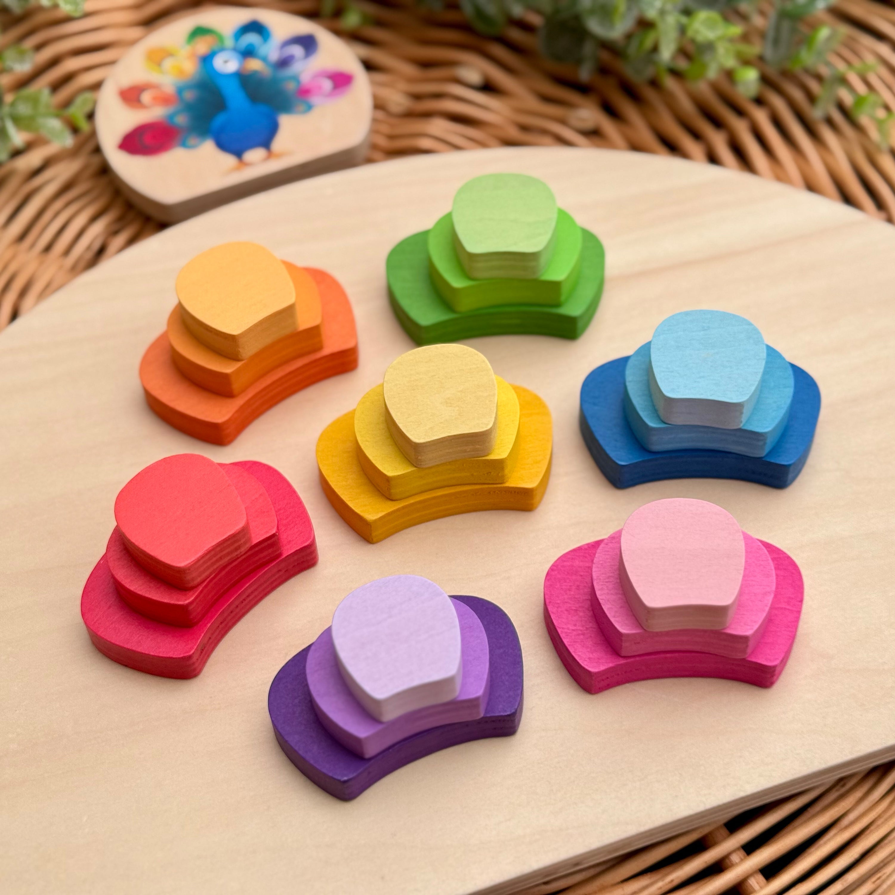 Colorful wooden shape blocks on a wooden board with a wicker background