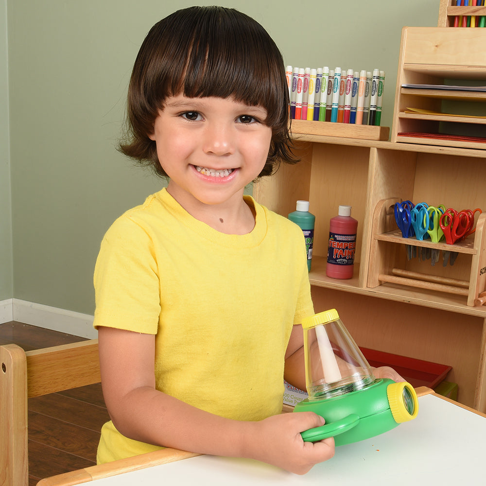 Kid Posing with Dual View Nature Explorer Microscope in the Classroom