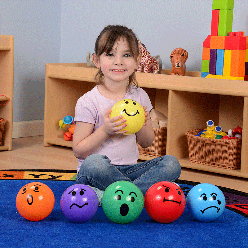 Child Mimicking Facial Expressions with Ball Set