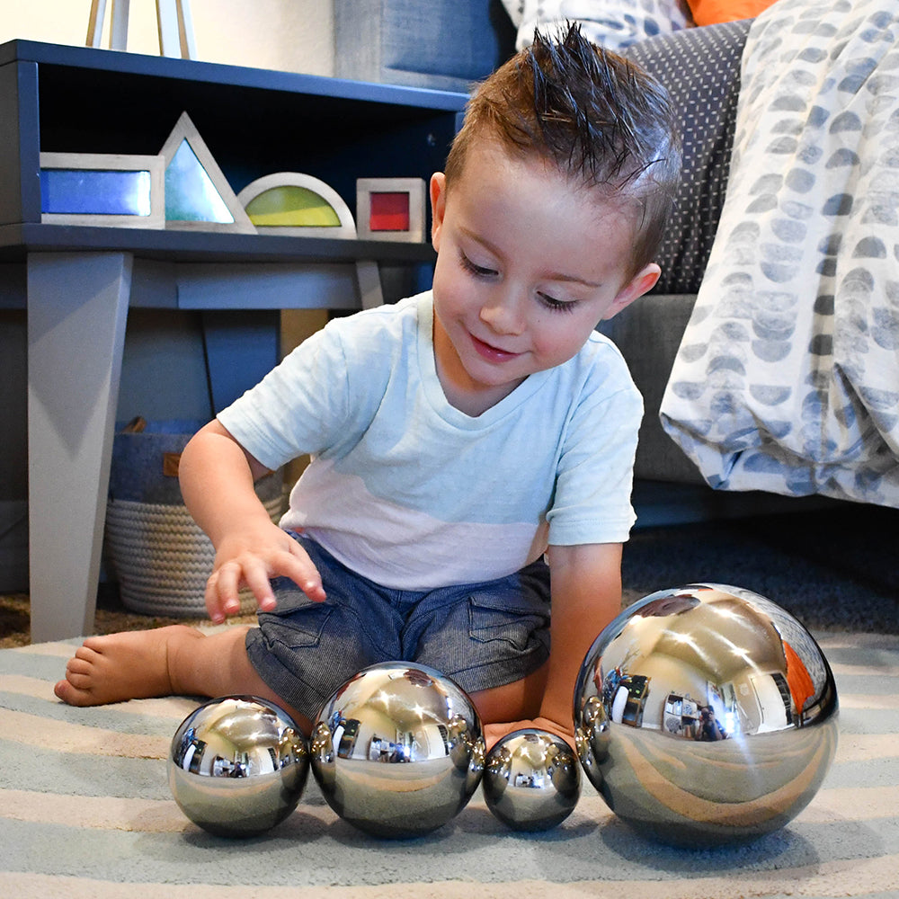 Kid Looking at Reflection with Mirror Balls Set
