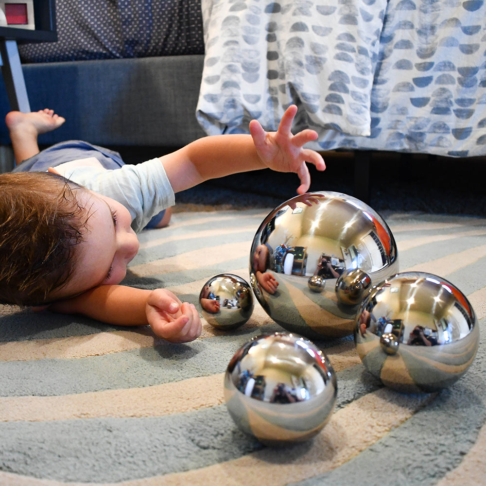 Kid Looking at Reflection with Mirror Balls Set