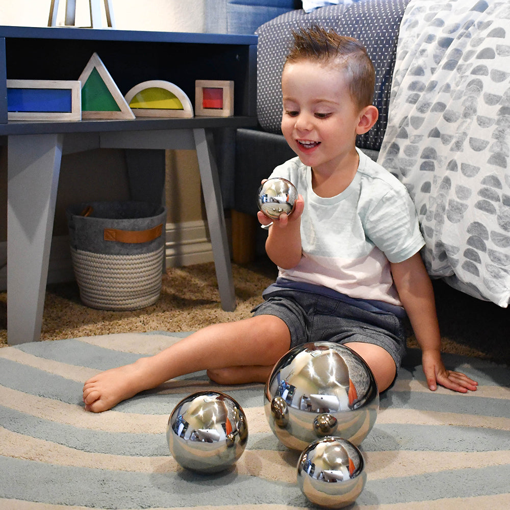 Kid Looking at Reflection with Mirror Balls Set