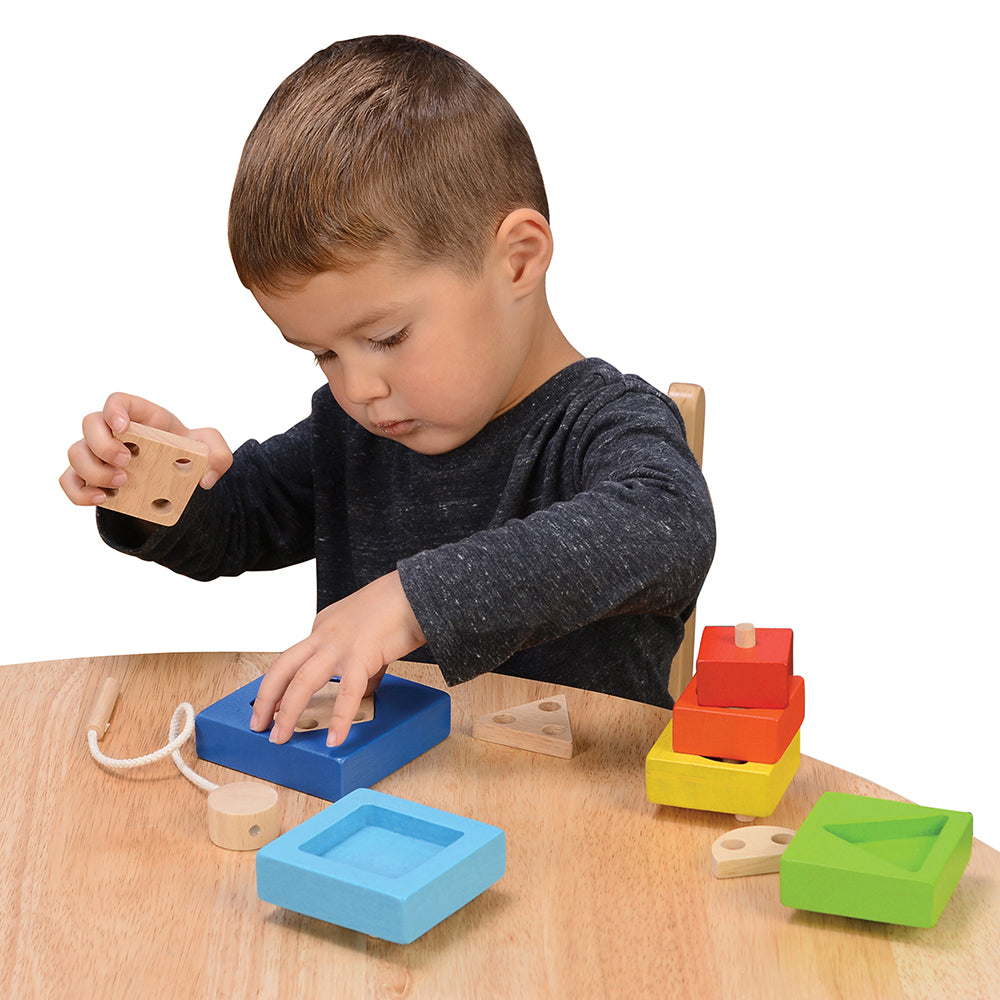 Kid Working with Wooden Shapes