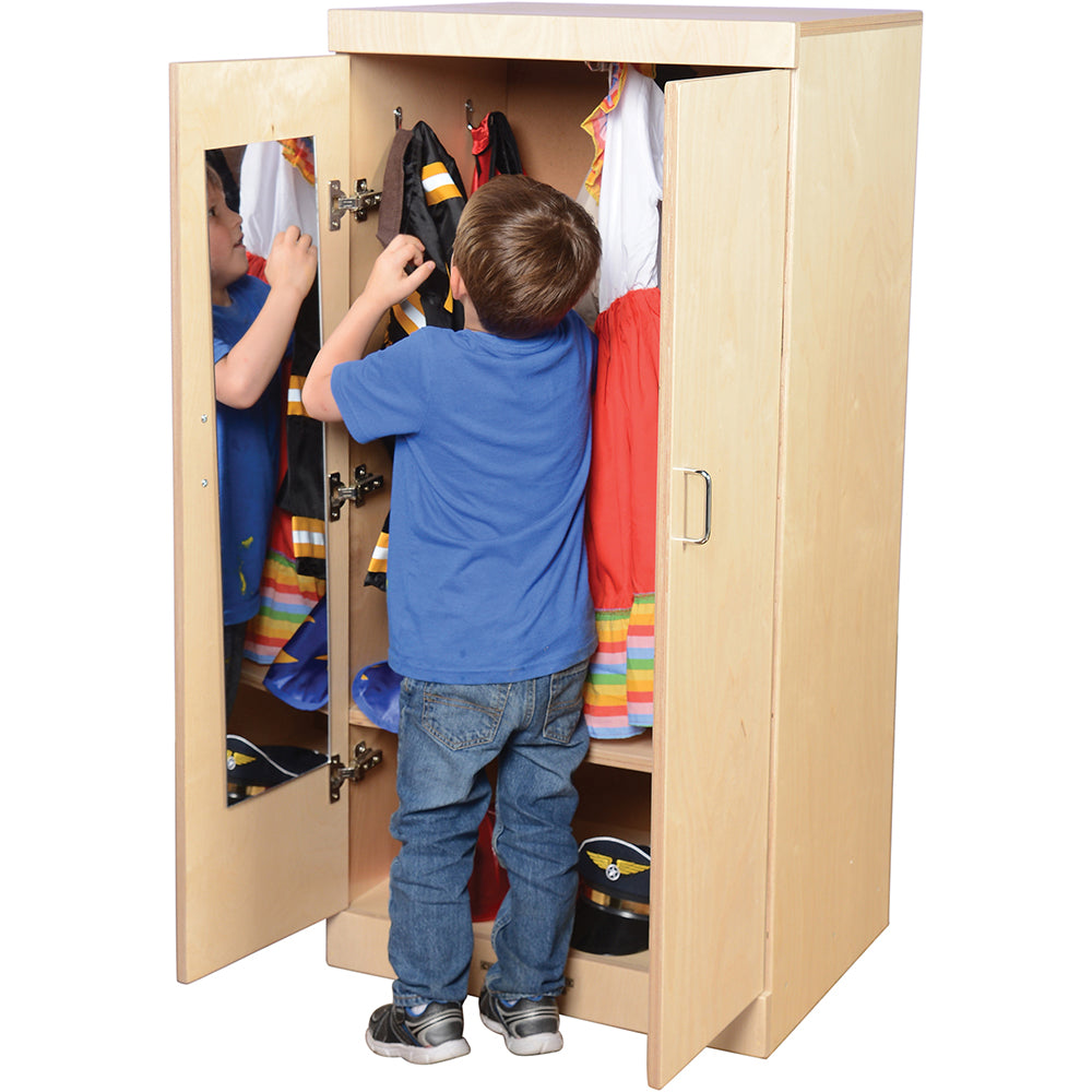 Kid Hanging up Cape in Child-Sized Wooden Dress Up Cupboard