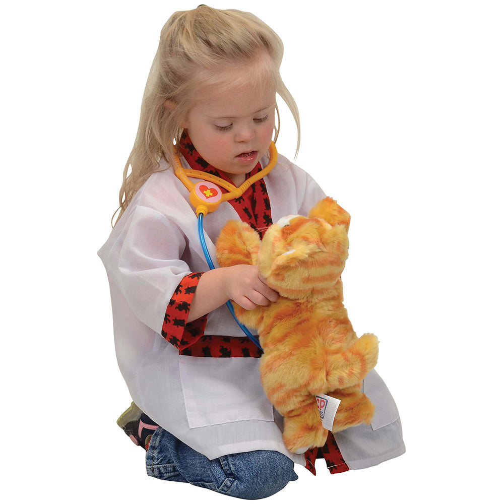 Child in red & white vet coat with stuffed cat toy