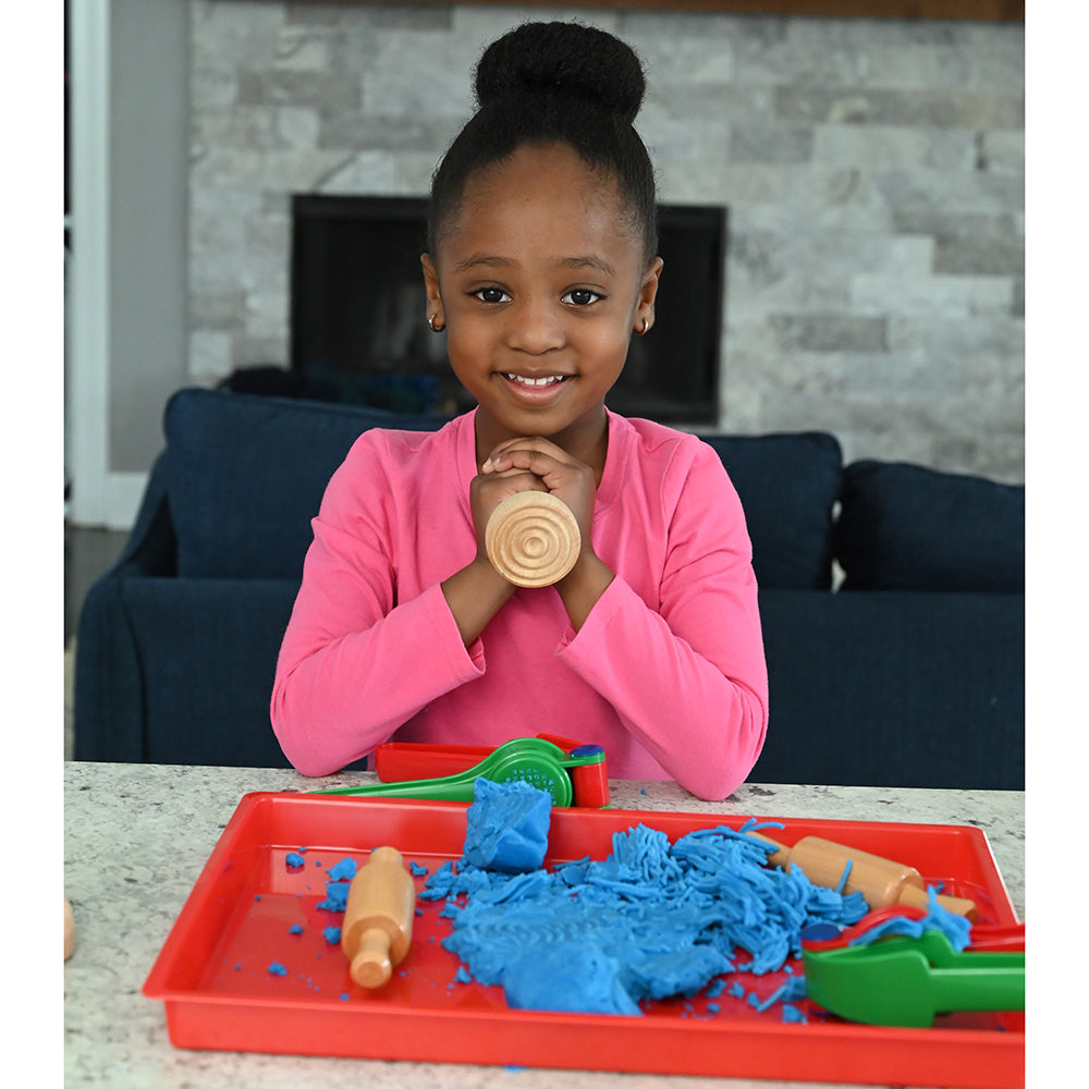 Child Showcasing Wooden Dough Stamper