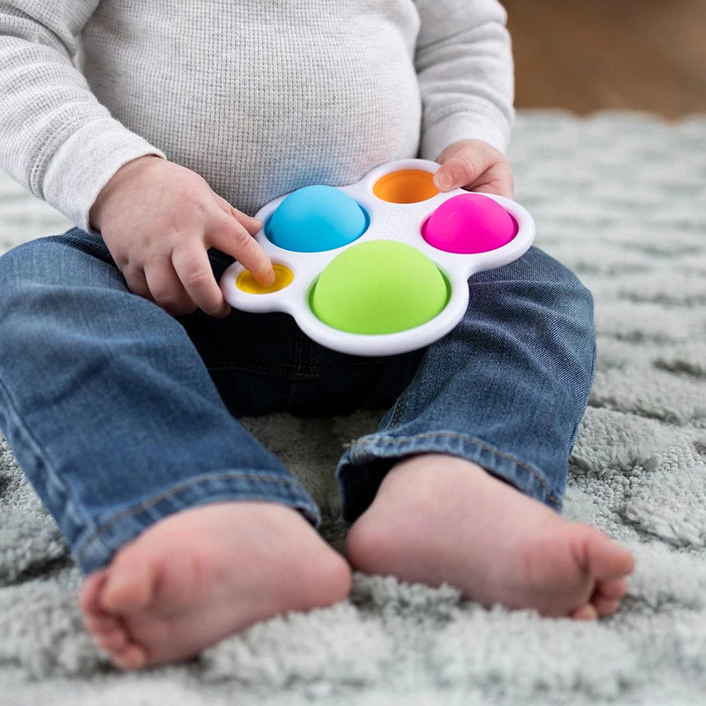 Close-up of Infant Holding Dimple Toy