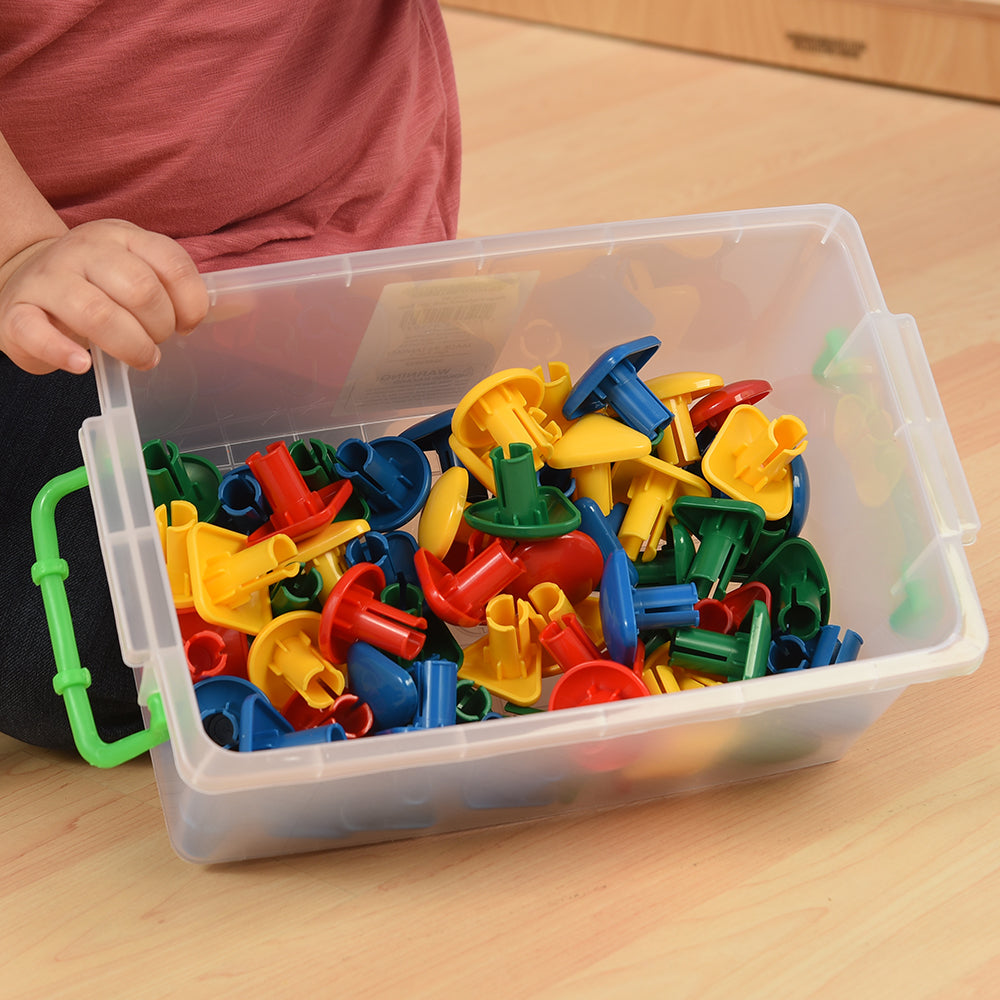 Close-up of colorful pegs in clear tote