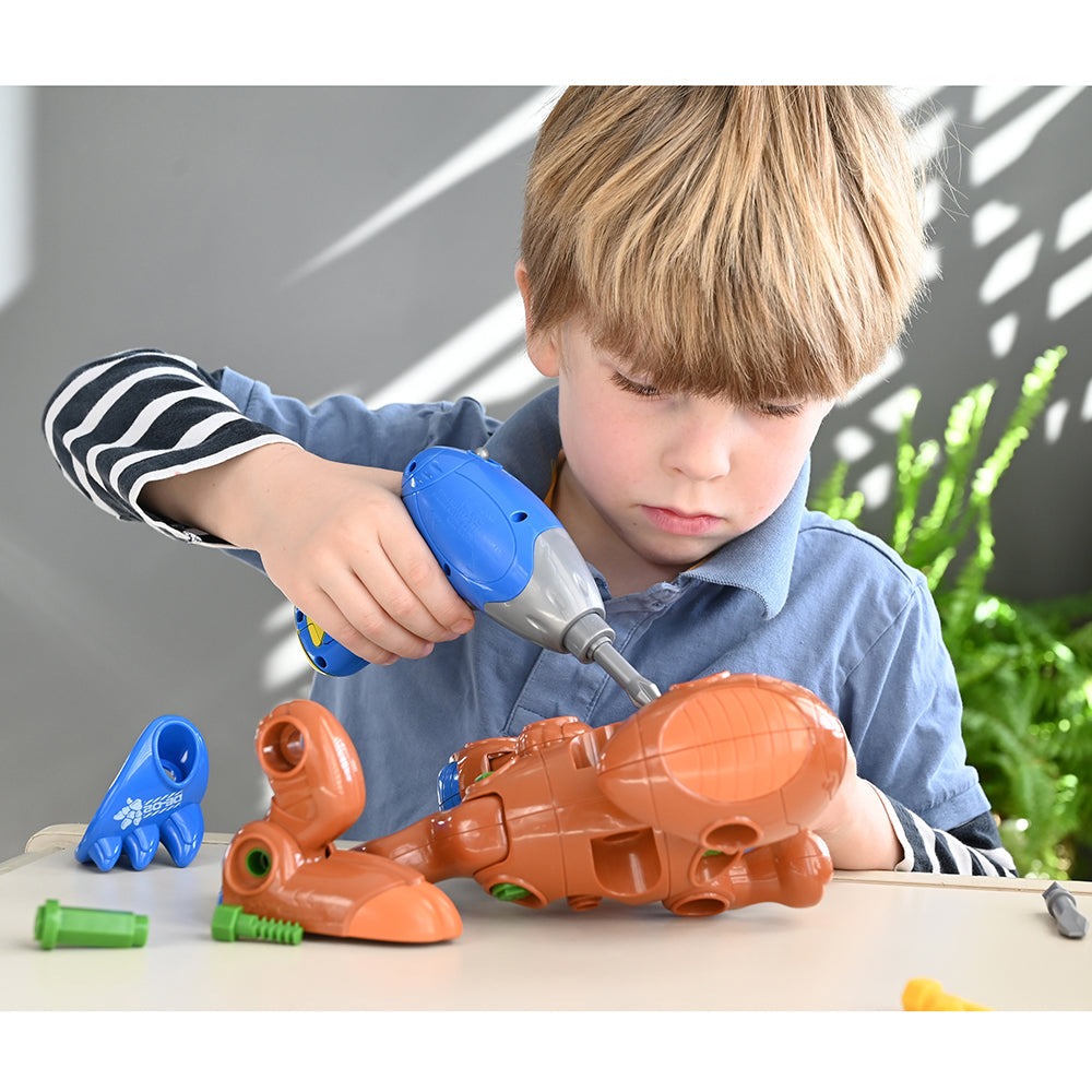 Kid Using Drill to Build Create-A-Dino T-Rex