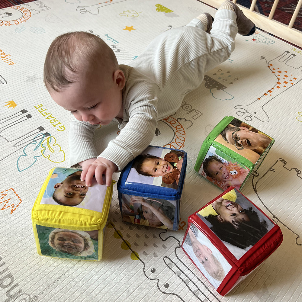 Baby Reaching For Stacking Blocks with Photo Pockets