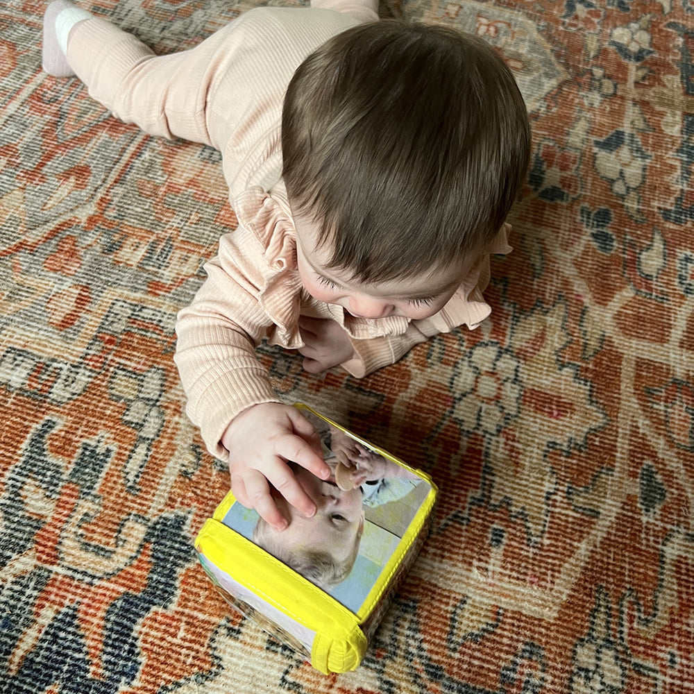 Baby Touching Yellow Stacking Block