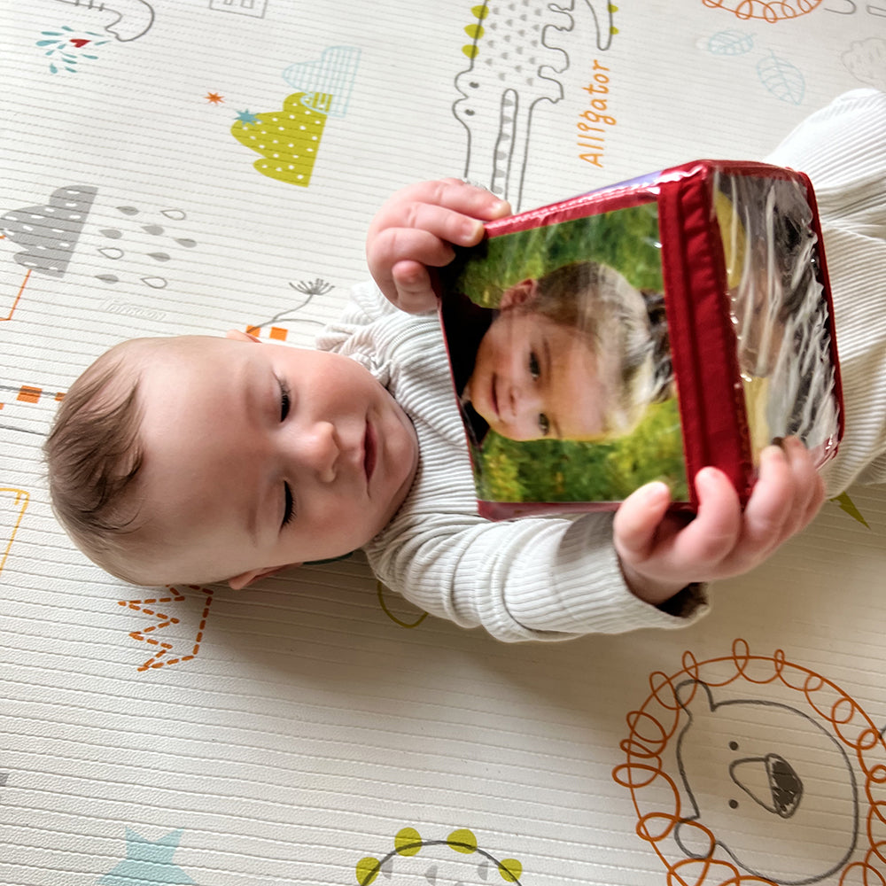 Baby Holding Red Stacking Block with Customizable Photo Pockets