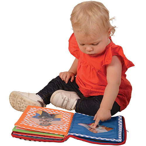 Baby Pointing at Picture in Baby's First Photo Album