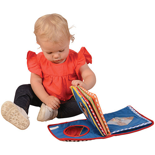 Baby Turning Cloth Pages of Baby's First Photo Album