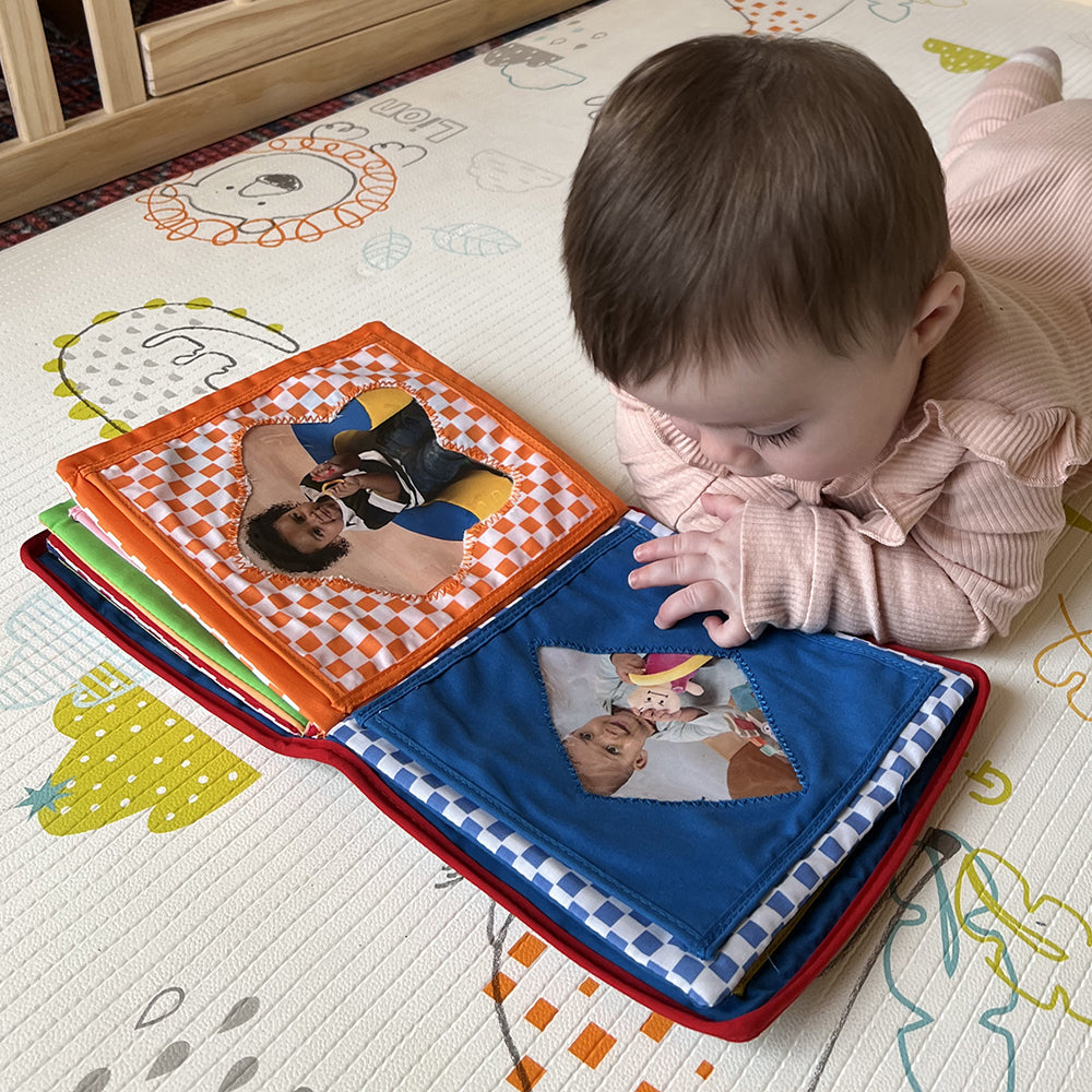 Baby Looking At Pages of Baby's First Photo Album