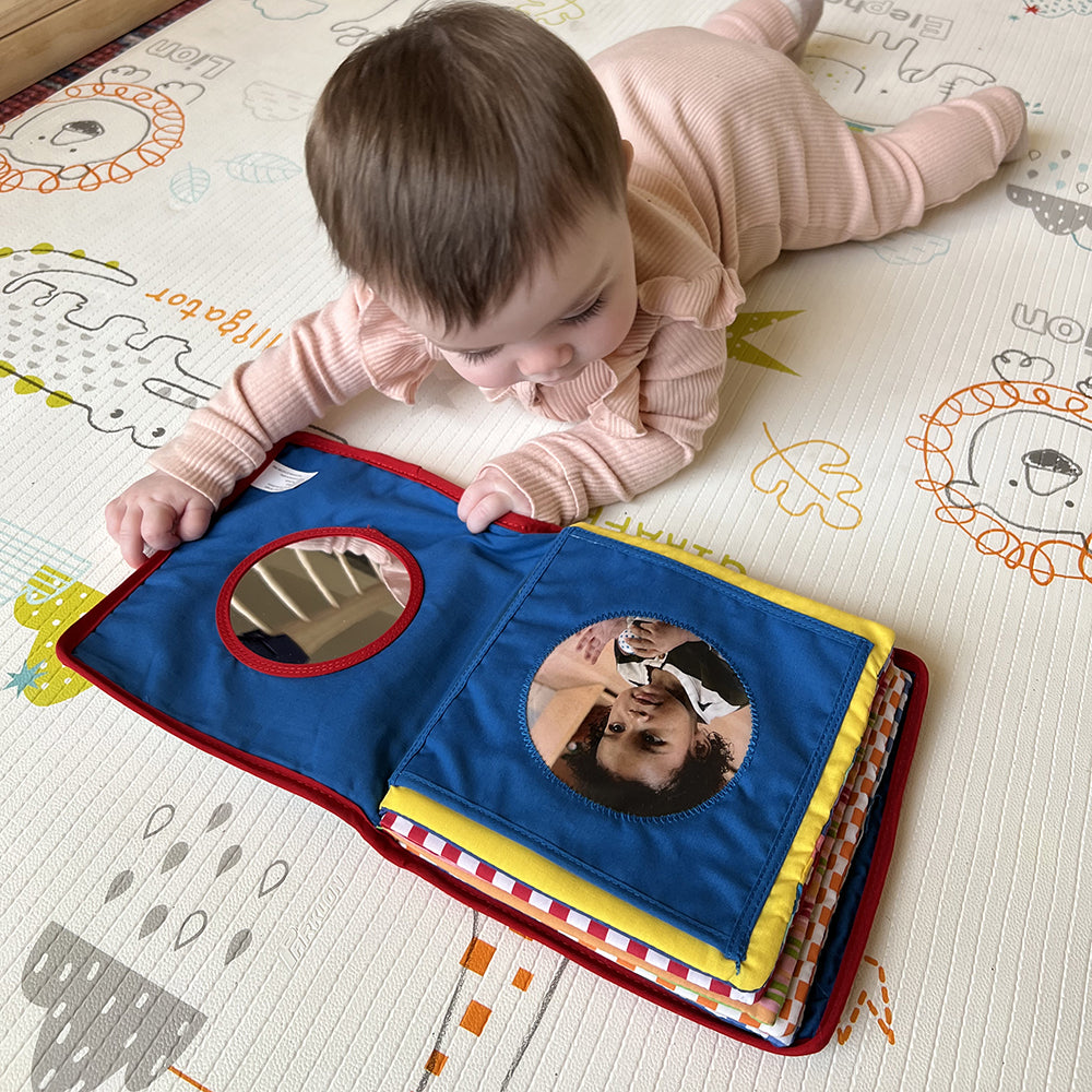 Baby Engaging with Baby's First Photo Album