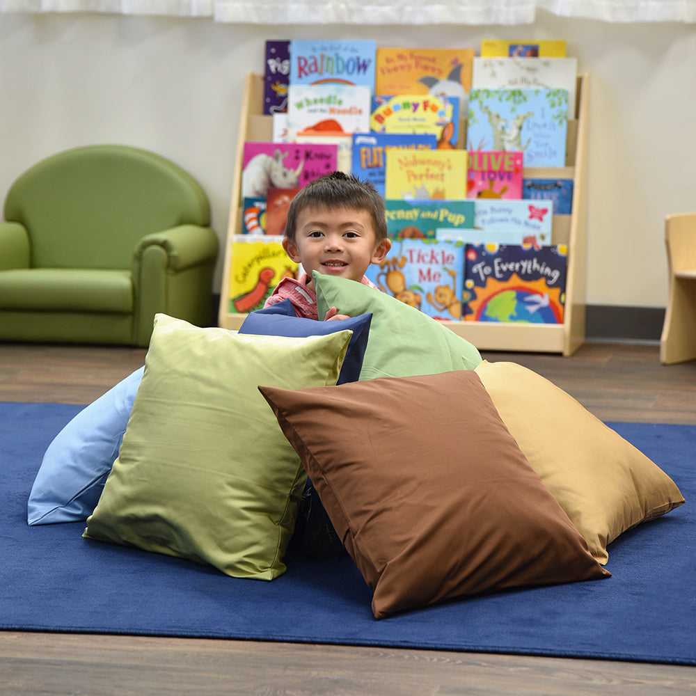 Child in a Classroom Surrounded by Natural & Calm Colors Oversized Pillows