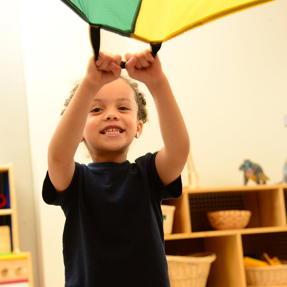 Close-up of Kid Using Handles on 6 FT Parachute in Classroom