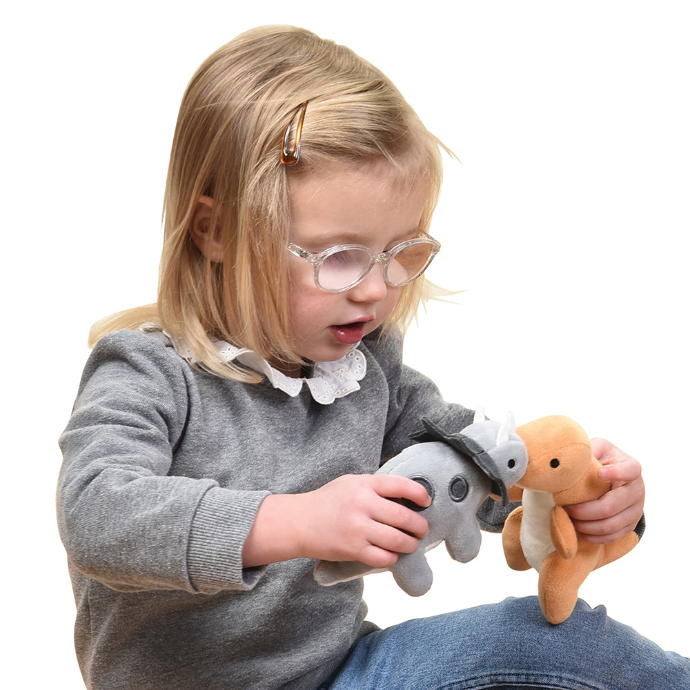 Kid Playing with Plush Triceratops & T-Rex