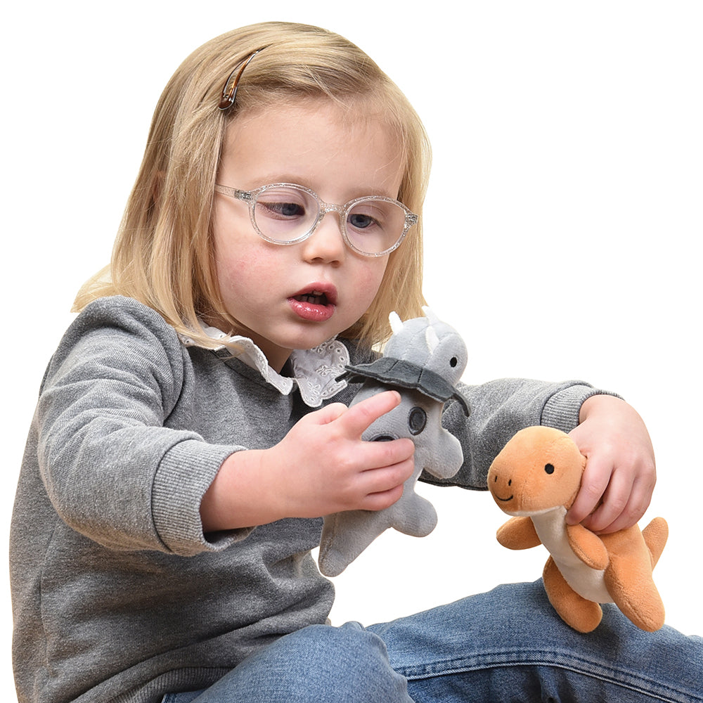 Kid Having Fun with Plush Triceratops & T-Rex