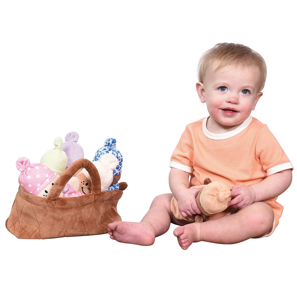 Baby with Basket of Dolls