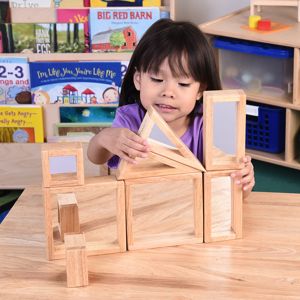 Child Using Geometric Mirrored Building Blocks in the Classroom