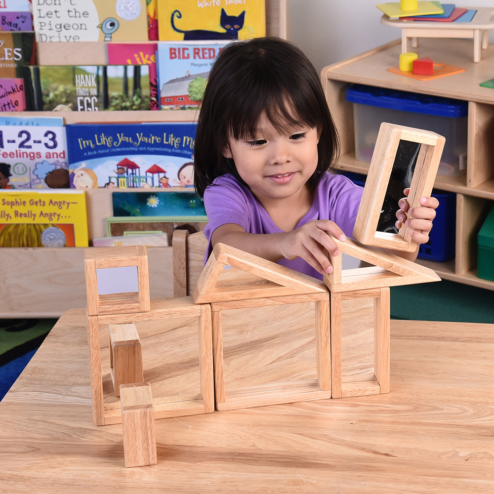 Child Using Geometric Mirrored Building Blocks in the Classroom