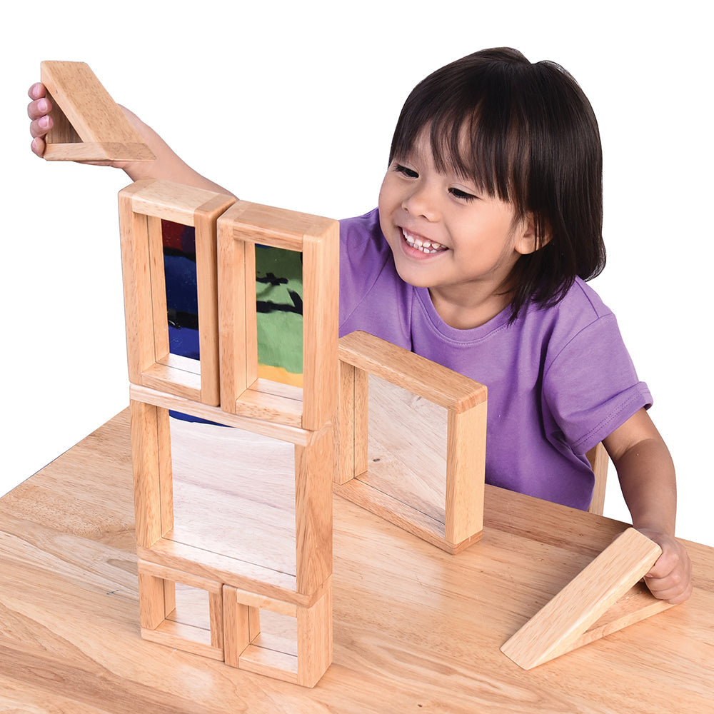 Child Interacting with Geometric Mirrored Building Blocks
