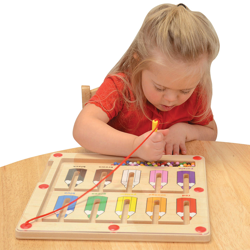 Child Sorting Colors with Magnetic Color Matching Game